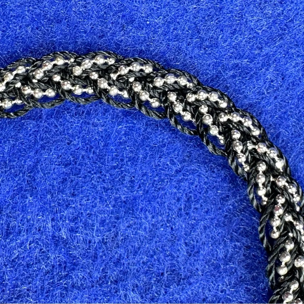 Boho Braided Silver tone and black bracelet with tassel.